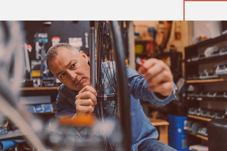 Business Loans Small Business Man Fixing Bicycle